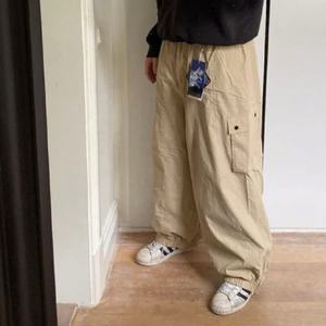 Pantalones de esquí impermeables holgados para hombre y mujer, pantalones de snowboard cortavientos, pantalones térmicos cálidos para exteriores, pantalones de nieve de invierno, ropa de ajuste holgado - Product Image 1
