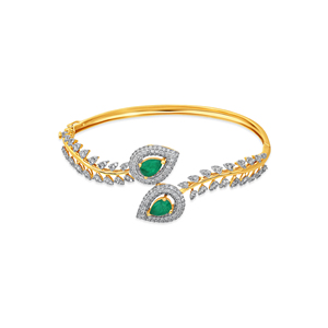 Elegant Gold <b>Bangle</b> <b>Bracelet</b> with Emerald Teardrop Gemstones, Diamond Leaf Motifs, and Luxurious Pavé Detailing - Product Image 1