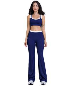 ชุดออกกำลังกายผู้หญิงสีน้ำเงินกรมท่าตัดขาว ประกอบด้วยเสื้อชั้นในกีฬาและกางเกงขาบานเอวสูง ผ้าสเตรช เหมาะสำหรับโยคะ ฟิตเนส และยิม รับผลิตตามสั่ง ขายส่ง OEM - Product Image 1