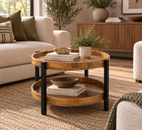 Table basse ronde en bois de manguier au design industriel moderne, durable, avec structure métallique et rangement à deux niveaux pour le salon