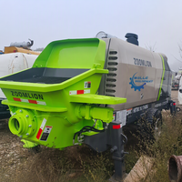 Pompe à béton tractée Zoomlion à longue portée, stable et modulaire, conçue pour les chantiers de construction en espaces restreints
