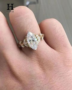 Anillo de compromiso marquesa de moda con banda entrelazada de ramas y delicado racimo de hojas, joyería de oro de 10K y 14K - Product Image 1