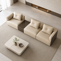 Canapé modulaire en forme de L en cuir véritable beige moderne et écologique avec larges accoudoirs et coussins de dossier doux pour hôtels et appartements