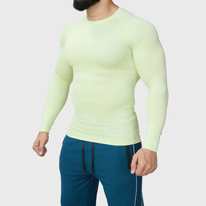 เสื้อรัดรูปแขนยาวสีเขียวอ่อนสำหรับผู้ชาย ผลิตจากผ้าสแปนเด็กซ์และโพลีเอสเตอร์ แห้งเร็ว ไร้ตะเข็บ กระชับรูปร่าง เหมาะสำหรับเล่นกีฬา ดีไซน์ล่าสุด ขายส่ง - Product Image 3