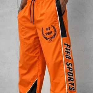 Pantalon de survêtement coupe-vent pour homme, bas de tenue haute performance conçu avec un matériau léger et à séchage rapide pour l'exercice et la course à pied - Product Image 6