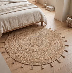 Handmade <b>Round</b> Braided Jute Rug with Natural Fringe Farmhouse Bedroom Rug for Relaxed Boho Interior Styling - Product Image 1