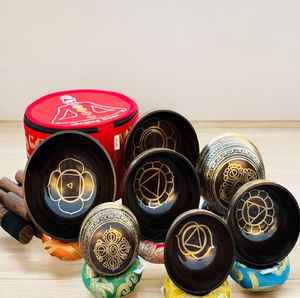 Seven chakra colored brass Tibetan singing bowl set with wooden strikers, available at wholesale prices. - Product Image 2