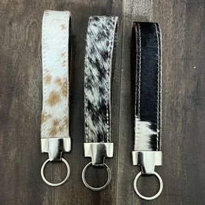 พวงกุญแจหนังวัวแท้แบบใหม่ พร้อมขน  ทนทาน ใช้ได้ทั้งชายและหญิง สำหรับกระเป๋า รถยนต์ และใช้ในชีวิตประจำวัน - Product Image 5