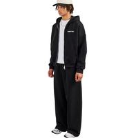 Ensemble de survêtement décontracté deux pièces pour homme avec sweat à capuche zippé, poches fendues et pantalon large à cordon de serrage