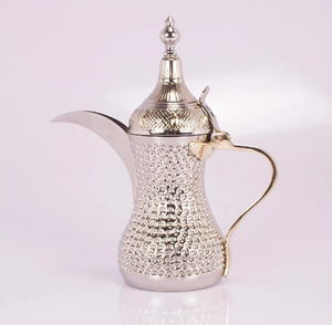 Polished <b>silver</b> Dallah featuring a dimpled texture and gold-tone accents, at wholesale prices, perfect for modern homes. - Product Image 1