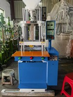 Machine de moulage par injection verticale d'occasion 25 tonnes 35 tonnes Machines de moulage de plastique PVC pour la fabrication de prises électriques