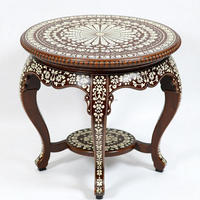 Table élégante artisanale pour une décoration intemporelle du salon et de la chambre à coucher, design complexe en incrustation d'os, ronde, en bois, moderne
