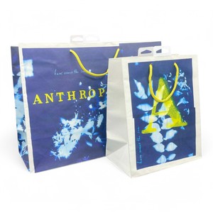 IntBOX elegante bolsa de compras de papel blanco con diseño amarillo azul llamativo asas dobles ecológicas para exposiciones de promoción minorista - Product Image 3