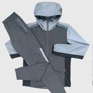 Survêtement de sport imperméable à capuche en nylon coupe-vent pour homme, style parachute, pour la course et le jogging - Fournisseur en gros - Product Image 1
