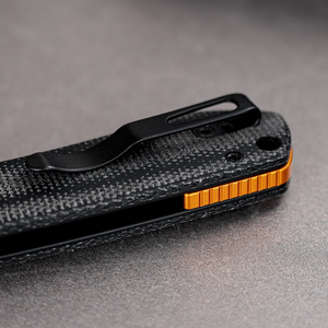 Cuchillos plegables con mango de textura negra, hoja de punta caída con acabado stonewashed plateado y clip de bolsillo con perilla naranja para uso diario al aire libre - Product Image 6