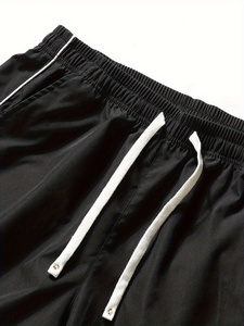 Pantalon de survêtement blanc surdimensionné pour homme, coupe large, avec empiècements latéraux contrastants noirs et détails de passepoil, taille à cordon de serrage – Vente en gros personnalisée - Product Image 5