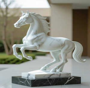 Modern white marble sculpture of a seated <b>nude</b> female figure bent forward over a rock pedestal. - Product Image 3