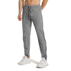 Pantalon de jogging unisexe RICSA gris à séchage rapide en coton, avec logo embossé et blocs de couleur, taille élastique et cordon de serrage, pour le sport et l'e-sport (taille adulte) - Product Image 1