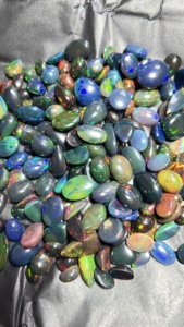 Opal noir naturel à prix abordable, cabochons de formes et tailles variées, pierres pour la fabrication de bijoux, fournisseur en gros Trimurti Gems, évalué par une tierce partie - Product Image 1