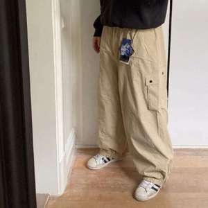 Pantalones de esquí y snowboard impermeables de talla grande para hombre y mujer, cortavientos, térmicos, tipo cargo, holgados, para invierno y actividades al aire libre. - Product Image 3