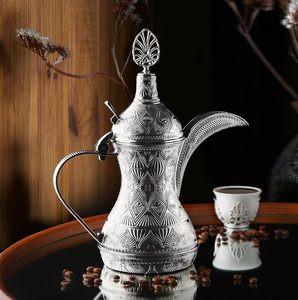 A vintage-style <b>silver</b> engraved dallah featuring traditional Middle Eastern crest motifs, available at wholesale prices. - Product Image 6