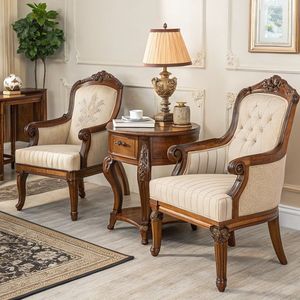 Este sillón es un sofá individual de estilo francés en madera de caoba con intrincadas grabados y tapicería de tela color crema con detalles en marrón. - Product Image 3