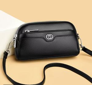 Sac à bandoulière noir en cuir véritable pour femme avec fermeture éclair et fermoir, style minimaliste, sac bandoulière pour usage quotidien - Product Image 1