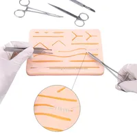 Kit complet de pratique de suture réutilisable avec coussinet en silicone et instruments chirurgicaux en acier inoxydable pour la formation médicale - Fournisseur en gros