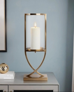 Porte-bougie moderne en métal doré avec insert cylindrique en verre transparent pour une décoration élégante de table et de la maison - Product Image 1