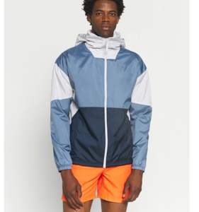 Chaquetas de Lluvia de Nailon con Diseño Moderno y Logotipo Personalizado, Chaqueta Cortavientos Impermeable para Hombre con Bloques de Color, Chaquetas de Invierno 100% Poliéster - Product Image 1