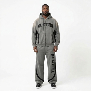 Conjunto deportivo de dos piezas para hombre, con sudadera con capucha gris con cremallera y bloques de color, y pantalones deportivos de pierna ancha. - Product Image 1