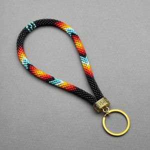 Porte-clés de poignet tendance fait main pour femme, orné de perles, motifs noir, rouge, orange, jaune, turquoise, blanc, avec anneau doré, pour usage quotidien - Product Image 6