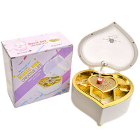Boîte à musique élégante ovale en cristal avec manivelle, durée de 30 secondes, couleur et logo personnalisables, boîte de rangement rotative dansante pour filles