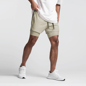 Shorts de course pour homme, couleur unie, poches, logo sur le devant, séchage rapide, respirant, taille élastique, vêtements de sport - Product Image 1