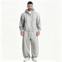 Ensemble de survêtement décontracté haut de gamme gris clair moderne, respirant, avec sweat à capuche zippé et pantalon large à cordon de serrage, deux pièces