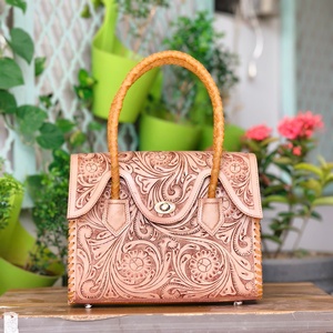 Sac à main de luxe en cuir véritable, couleur unie, avec poignée tressée et embossage, fermeture éclair durable, antivol, portable, pour la plage, printemps-été - Product Image 1