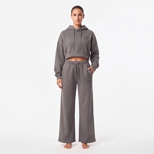 Conjunto de sudadera con capucha de manga larga y hombros caídos y pantalones jogger de pierna ancha con cordón, de marca privada personalizada para mujer - Product Image 1