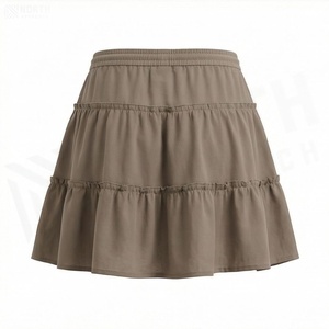 Jupe courte à volants pour femmes, taille élastique, couleur unie, design décontracté en forme de A, tissu polyester confortable, à porter en toutes saisons - Product Image 2