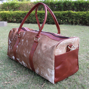 Premium cowhide leather hair on travel <b>bags</b> wholesale supplier OEM custom logo handmade export fashion luggage <b>bags</b> for sale - Product Image 4