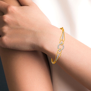 14K Yellow Gold Diamond <b>Infinity</b> Twist Bangle <b>Bracelet</b> | Elegant Interlocking Knot Fine Jewelry for Women - Product Image 3