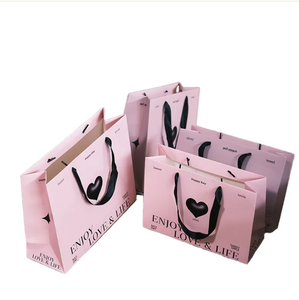 ถุงกระดาษเสริมความแข็งแรงสไตล์ทันสมัย พร้อมหูหิ้วออกแบบตามหลักสรีรศาสตร์ พื้นผิวเรียบพร้อมพิมพ์ลาย  อุปกรณ์เสริมสำหรับร้านค้าสมัยใหม่ - Product Image 1