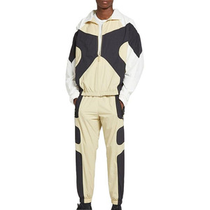 Premium men's lightweight tracksuit. Features high-contrast geometric paneling and matching <b>joggers</b>. Athletic fit. - Product Image 2