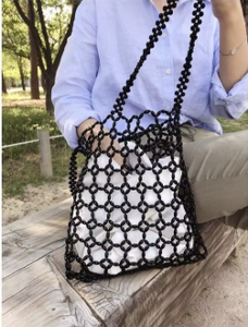 Las variaciones naturales en la técnica de tejido y textura hacen que cada bolso sea bellamente único y muestra una auténtica artesanía. - Product Image 1