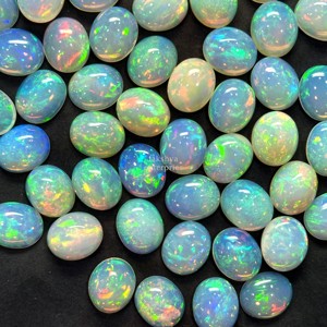 Cabujón ovalado de ópalo de fuego etíope natural de 10x12 mm con efecto de fuego AAA, piedras preciosas sueltas para la fabricación de joyas a precio mayorista. - Product Image 1