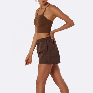 Ensemble de yoga 2 pièces sans coutures pour femme : soutien-gorge de sport et short à bretelles croisées, taille mi-haute, logo avant, séchage rapide, personnalisable OEM - Product Image 1