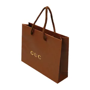 चीनी निर्माताओं द्वारा निर्मित आपके अपने लोगो और कॉटन हैंडल के साथ उच्च गुणवत्ता वाले ब्रांड एम्बॉसिंग बुटीक शॉपिंग पेपर बैग