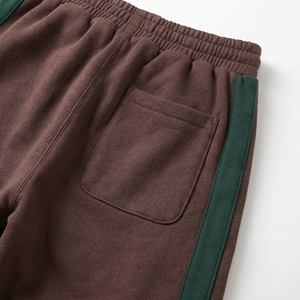 กางเกงวอร์มลายทางสีน้ำตาลเขียว |   กางเกงจ็อกเกอร์แบบมีแผงข้างตัดกัน |   กางเกงวอร์มสตรีทแวร์ทรงโอเวอร์ไซส์ |   ผู้ผลิต OEM ตามสั่ง - Product Image 4