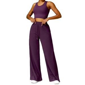 Ensemble de yoga deux pièces : Crop top sans manches dos nageur et pantalon taille haute à jambes larges, couleur unie, respirant, taille élastique torsadée - Product Image 1