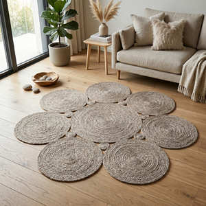Grey Braided <b>Round</b> Jute Rug with Decorative Floral Arrangement for Contemporary Living Spaces - Product Image 1