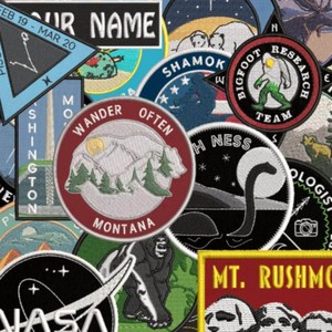 Patch brodé Wander Often Montana, appliqué en tissu thermocollant rond pour cadeaux, avec fixation auto-agrippante - Product Image 1